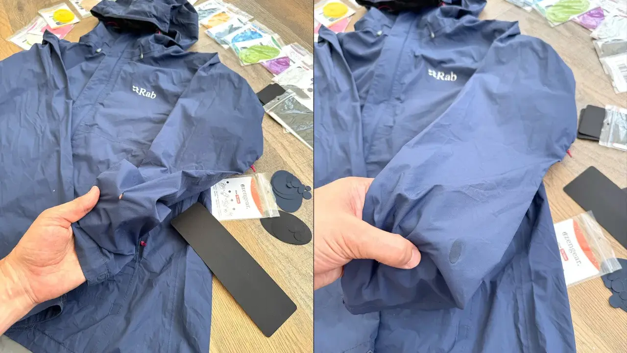 Blaue Regenjacke reparieren: Ein Loch im Ärmel wird mit einem Reparaturflicken aus dem Set ausgebessert.