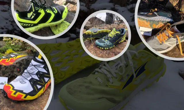 Verschiedene trailrunning schuhe zum joggen geeignet, teils schlammig, teils auf Schnee und Steinen liegend.